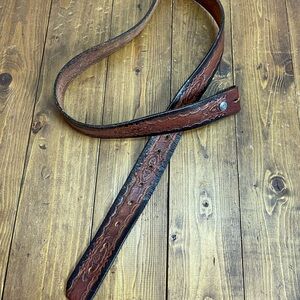 Brown leather belt with embossed design